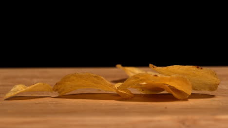 Chips-falling-on-wooden-table