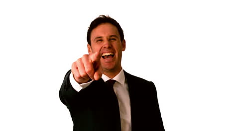 Happy-businessman-laughing-and-pointing-to-camera