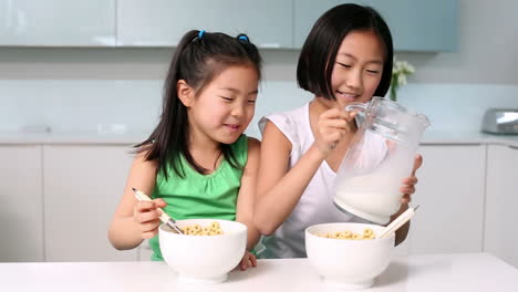 Two-girls-eating-cereal