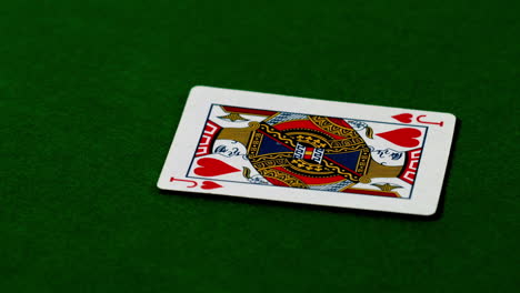 Jack-of-hearts-falling-on-casino-table
