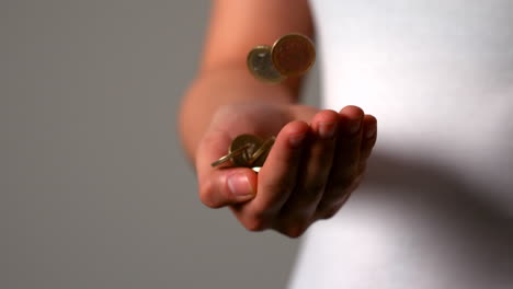 Woman-catching-falling-euro-coins