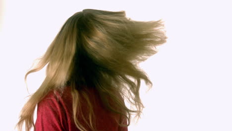 Pretty-blonde-tossing-her-hair
