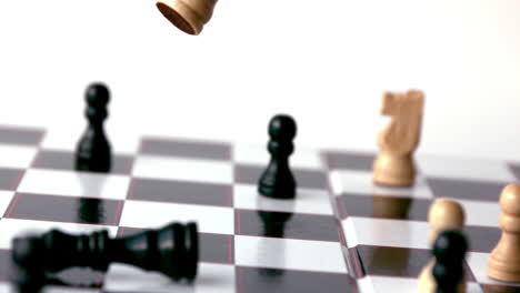 White-chess-piece-knocking-over-a-black-one