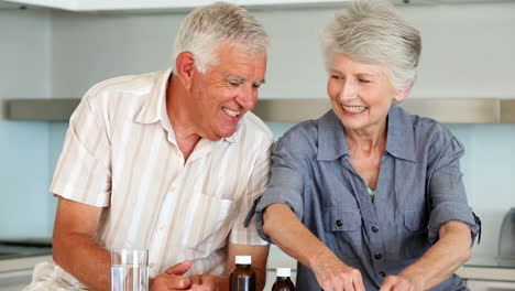 Senior-couple-organizing-their-medicine-for-the-week