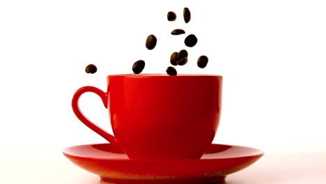 Coffee-beans-falling-into-red-cup