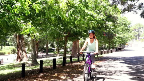 Fit-young-woman-going-for-a-bike-ride