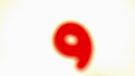 Red-number-nine-lifting-off-white-background