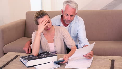 Worried-couple-working-out-their-finances