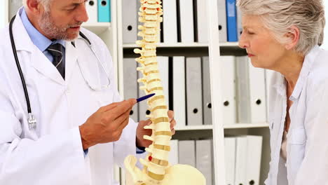 Doctor-explaining-a-spine-model-to-patient