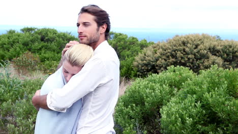 Young-couple-hugging-by-the-sea