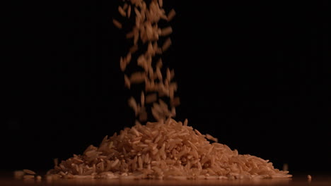 Rice-pouring-on-black-background