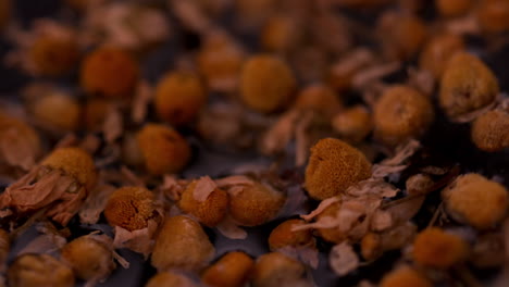 Dried-herbal-tea-swirling-in-water