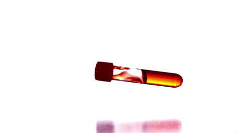 Reagenzglas-Mit-Fallender-Roter-Flüssigkeit