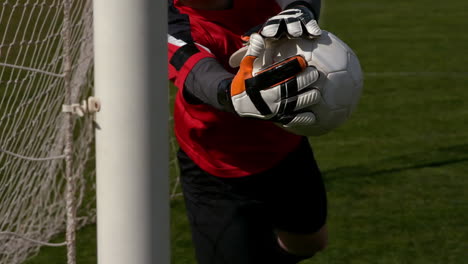 Goalkeeper-in-red-saving-a-goal-during-a-game