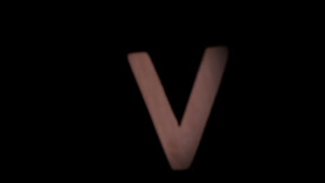 The-letter-v-rising-on-black-background