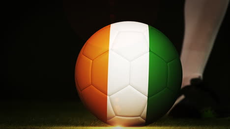 Football-player-kicking-ivory-coast-flag-ball