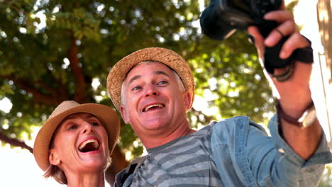 Senior-couple-taking-a-selfie-on-sunny-day