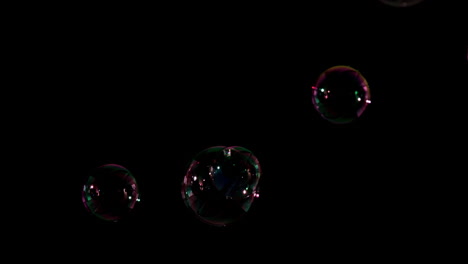 Bubbles-floating-on-black-background