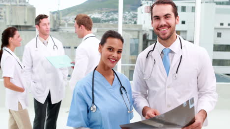 Medical-team-smiling-at-camera-together