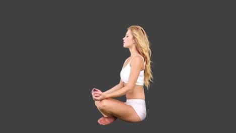 Pretty-blonde-sitting-in-lotus-pose