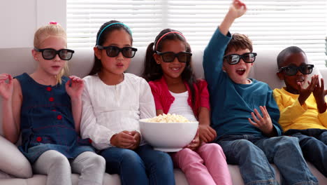 Cute-children-watching-3d-movie-on-the-sofa
