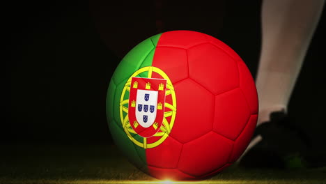 Football-player-kicking-portugal-flag-ball