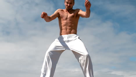 Martial-arts-expert-practicing-by-the-coast