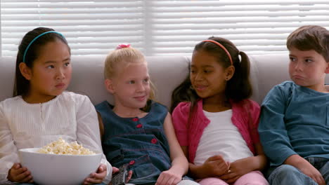 Cute-little-friends-sitting-on-couch-together