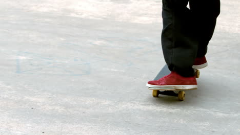 Young-skateboarder-skating-the-outdoor-skatepark