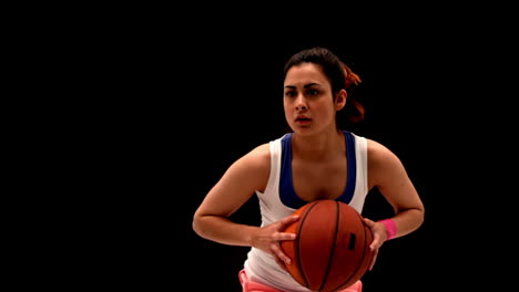 Fit-young-woman-playing-basketball
