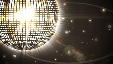 Shiny-gold-disco-ball-spinning-around