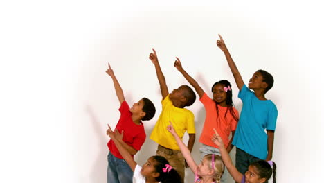Cute-little-children-all-pointing-up-on-white-background