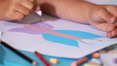 Preschool-class-drawing-at-table-in-classroom