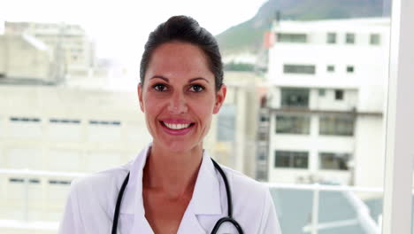 Pretty-nurse-smiling-at-the-camera