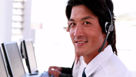 Call-centre-agents-working-and-talking-on-headsets