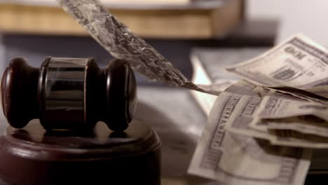 Dollars-falling-beside-hammer-and-gavel