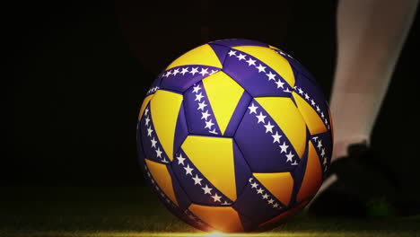 Football-player-kicking-bosnia-flag-ball