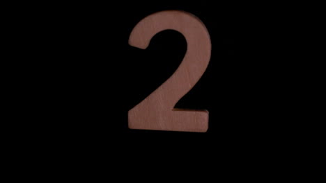 The-number-2-rising-on-black-background