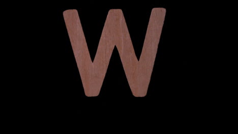 The-letter-w-rising-on-black-background