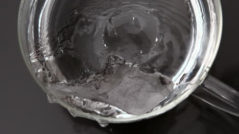 Teabag-falling-into-glass-cup