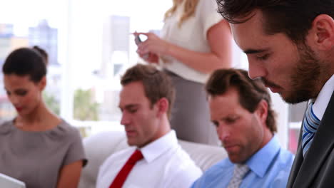 Business-team-sitting-in-staff-room