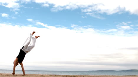 Martial-arts-expert-practicing-on-the-beach