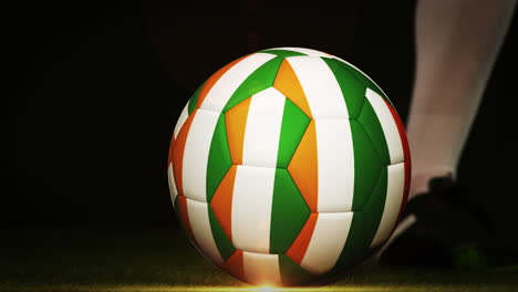 Football-player-kicking-ivory-coast-flag-ball