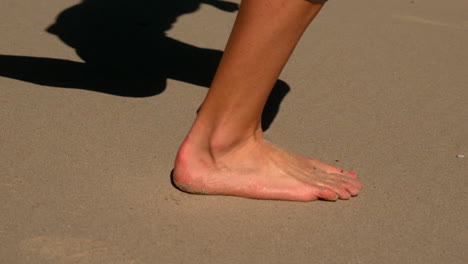 Woman-running-barefoot-on-the-sand