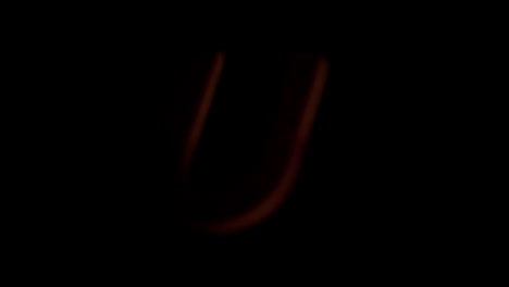 The-letter-u-rising-on-black-background