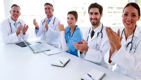Medical-team-clapping-during-a-meeting