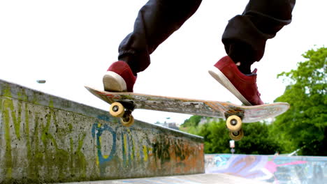 Young-skateboarder-skating-the-outdoor-skatepark