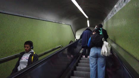 Argentine-people-commute-on-public-underground-transport,-automatic-stairs