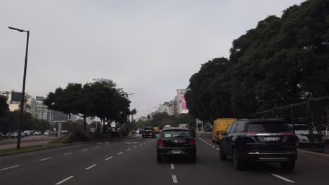 POV-drive-at-9-de-Julio-Avenue-asphalted-Argentine-fast-Capital-car-traffic-lane