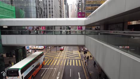 Profile-view-of-walk-over-way-on-top-of-Des-Voeux-Road-in-Central,-Hong-Kong